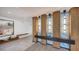 Modern lobby with designer lighting, decorative paneling, tiled floors, and seating at 650 Golden Gate Pt # 602, Sarasota, FL 34236