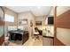 Home office is complete with dual monitors, built-in shelving, and ample workspace for productivity at 650 Golden Gate Pt # 602, Sarasota, FL 34236