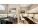 Well-lit home office features a dedicated workspace with multiple screens, storage, and sleek, modern furniture at 650 Golden Gate Pt # 602, Sarasota, FL 34236