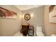 Chic powder room with a vessel sink, modern fixtures, and stylish artwork at 650 Golden Gate Pt # 602, Sarasota, FL 34236