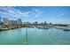 Stunning water view of the marina from a high-rise condo, showcasing the vibrant city skyline at 650 Golden Gate Pt # 602, Sarasota, FL 34236