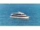 Luxury yacht sailing on calm waters, offering scenic views and a smooth ride at 650 Golden Gate Pt # 602, Sarasota, FL 34236