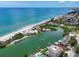 Beautiful beach inlet showcasing beach homes, boat docks, and stunning waterfront scenery at 6512 Midnight Pass Rd # 504, Sarasota, FL 34242