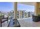 Relaxing balcony with outdoor seating and views of the city skyline at 6512 Midnight Pass Rd # 504, Sarasota, FL 34242