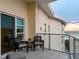 Cozy balcony with seating and stunning ocean views in a modern building at 6512 Midnight Pass Rd # 504, Sarasota, FL 34242