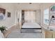 Versatile flex room with a Murphy bed, desk, and ample natural light at 6512 Midnight Pass Rd # 504, Sarasota, FL 34242