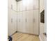Spacious walk-in closet featuring custom shelving and hardwood floors for optimal storage at 6512 Midnight Pass Rd # 504, Sarasota, FL 34242