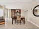 Bright dining area featuring modern wood accents and tile flooring at 6512 Midnight Pass Rd # 504, Sarasota, FL 34242