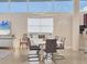 Stylish dining room with modern lighting, comfortable seating, and coastal decor at 6512 Midnight Pass Rd # 504, Sarasota, FL 34242