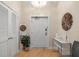 Inviting entryway featuring elegant decor, a stylish light fixture, and sleek hardwood flooring at 6512 Midnight Pass Rd # 504, Sarasota, FL 34242