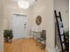 Bright entryway featuring modern decor, a stylish light fixture, and beautiful hardwood flooring at 6512 Midnight Pass Rd # 504, Sarasota, FL 34242
