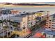 A stunning condominium building with a sunset over the ocean, near the white sandy beach at 6512 Midnight Pass Rd # 504, Sarasota, FL 34242