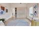 Versatile flex room with a Murphy bed, desk, and ample natural light at 6512 Midnight Pass Rd # 504, Sarasota, FL 34242