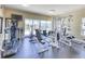 Well-equipped fitness center with various exercise machines, television, and a fan at 6512 Midnight Pass Rd # 504, Sarasota, FL 34242