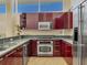 Contemporary kitchen featuring sleek cabinetry, modern appliances, and ample counter space at 6512 Midnight Pass Rd # 504, Sarasota, FL 34242