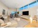Well-lit living room with contemporary furnishings, ocean views, and stylish decor at 6512 Midnight Pass Rd # 504, Sarasota, FL 34242