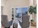 Bright living room with ocean view balcony, seating, and modern decor at 6512 Midnight Pass Rd # 504, Sarasota, FL 34242
