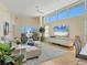 Spacious living room with ocean views, modern furniture, and stylish rug at 6512 Midnight Pass Rd # 504, Sarasota, FL 34242