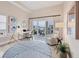 Cozy living room with a desk, chair, and a balcony at 6512 Midnight Pass Rd # 504, Sarasota, FL 34242