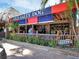 The Old Salty Dog restaurant with outdoor seating and a thatched roof at 6512 Midnight Pass Rd # 504, Sarasota, FL 34242