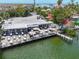 Waterfront restaurant showcasing a large outdoor dining deck with ample seating and scenic water views at 6512 Midnight Pass Rd # 504, Sarasota, FL 34242
