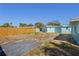 Backyard featuring a wood fence with partial grass and various stone pavers at 6520 Clemson St, Bradenton, FL 34207