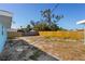 Backyard featuring a partial wood fence with small rock stepping stones at 6520 Clemson St, Bradenton, FL 34207