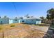 Backyard featuring a wood fence and concrete stone pavers in the grass at 6520 Clemson St, Bradenton, FL 34207
