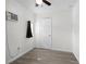 Cozy bedroom featuring an air conditioner, ceiling fan and modern light gray flooring at 6520 Clemson St, Bradenton, FL 34207