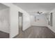 Spacious bedroom with neutral walls, modern ceiling fan, and an adjacent bathroom with walk-in shower at 6520 Clemson St, Bradenton, FL 34207