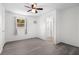 Bedroom featuring an air conditioner, ceiling fan and light gray flooring at 6520 Clemson St, Bradenton, FL 34207