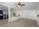 Bright living room features wood-look floors, white walls, and a breakfast bar with pendant lighting at 6520 Clemson St, Bradenton, FL 34207