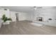 Bright living room featuring a decorative fireplace and neutral decor at 6520 Clemson St, Bradenton, FL 34207