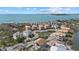 Picturesque aerial view featuring a pond and houses in different phases of construction by the ocean at 6924 Bochi Cir, Sarasota, FL 34242