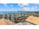 Aerial view of the community with condos near the ocean, palm trees, and nearby beaches at 6924 Bochi Cir, Sarasota, FL 34242