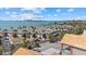 Coastal community condos overlooking beautiful views of the ocean, swaying palm trees, and sandy beach at 6924 Bochi Cir, Sarasota, FL 34242