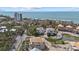 An aerial view of the property showcasing proximity to the beach, ocean views and pond at 6924 Bochi Cir, Sarasota, FL 34242