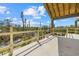 Unfinished balcony view featuring palm trees and a view of the street at 6924 Bochi Cir, Sarasota, FL 34242