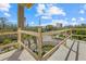 View from the unfinished balcony overlooking lush landscaping and a city skyline at 6924 Bochi Cir, Sarasota, FL 34242