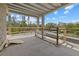 Partially constructed balcony with wooden railings offering scenic views and ample natural light at 6924 Bochi Cir, Sarasota, FL 34242