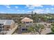 New construction home showcasing a partially completed facade with large windows and a modern design amidst a lush landscape at 6924 Bochi Cir, Sarasota, FL 34242