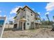 Exterior of a new construction home with multiple levels and a modern design at 6924 Bochi Cir, Sarasota, FL 34242