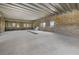 Expanansive interior with exposed concrete block walls, open floor plan, and large window openings at 6924 Bochi Cir, Sarasota, FL 34242