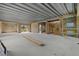 Open floor plan with concrete block walls and an unfinished staircase at 6924 Bochi Cir, Sarasota, FL 34242