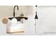 Showcasing interior doors, quartz tops, black faucets, cabinetry, and flooring options at 6924 Bochi Cir, Sarasota, FL 34242