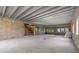 Open floorplan featuring concrete block walls, and the unfinished stairwell at 6924 Bochi Cir, Sarasota, FL 34242