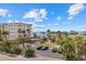 Scenic roof top view featuring palm trees, multiple unit buildings and beach access at 6924 Bochi Cir, Sarasota, FL 34242