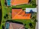 Overhead view of the tile roof, pristine lawn, and driveway of this beautiful home at 708 Foggy Morn Ln, Bradenton, FL 34212