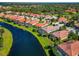 Beautiful aerial view of the community featuring a lake and gorgeous homes at 708 Foggy Morn Ln, Bradenton, FL 34212