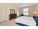 Cozy bedroom with natural light and neutral palette creating a peaceful retreat at 708 Foggy Morn Ln, Bradenton, FL 34212